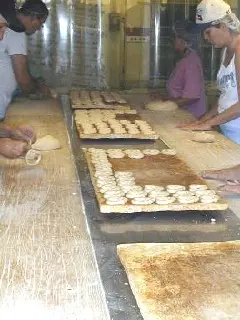 hand rolled sourdough pretzels twisted ready for the oven