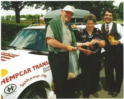 Hempfield Township Supervisor dressed in hemp with Jane Balmer PA's former tobacco grower chair &amp; Shawn House standing next to the VW that was powered on hemp bio diesel July 2001 