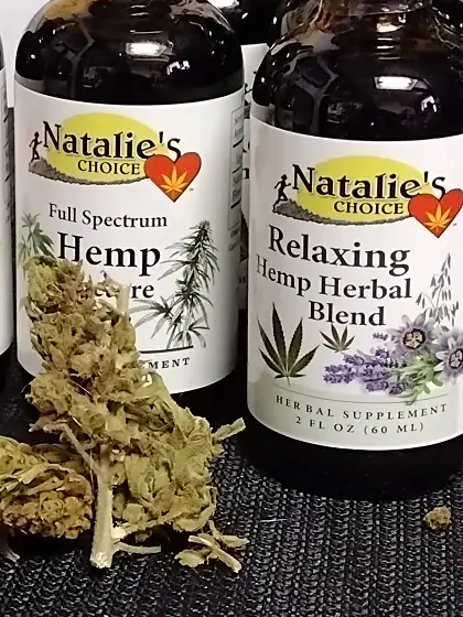 Hemp flower used in the two bottles behind it for health and wellness