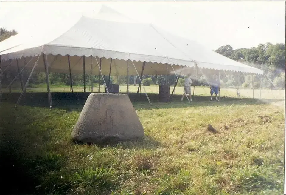 PA Hemp millstone near giant empty tent soon to be filled with hemp artifacts 