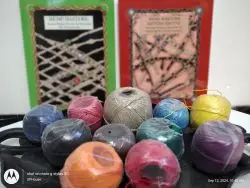 selection of assorted bright colors of hemp twine in front of 2 hemp jewelry how to books