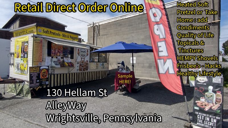 Concession trailer with open signs ready for retail.